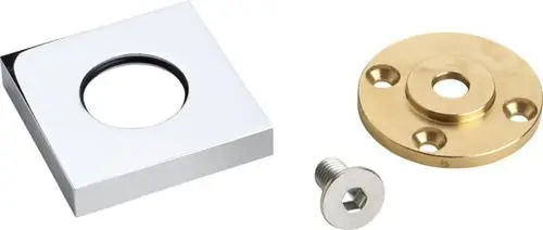 Befestigungsset bestehend aus einem quadratischen, verchromten Deckel, einer runden, goldfarbenen Grundplatte und einer silbernen Schraube. Ideal Standard.